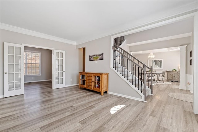 spare room featuring stairs, wood finished floors, and french doors