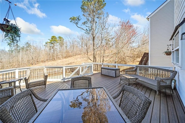 deck with outdoor dining space and an outdoor living space