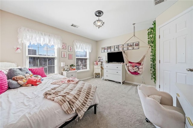 bedroom with light colored carpet, visible vents, and baseboards