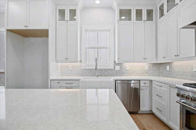 2035 Village Walk, Milton, GA 30004 - kitchen featuring appliances with stainless steel finishes, a sink, white cabinetry, decorative backsplash, and recessed lighting