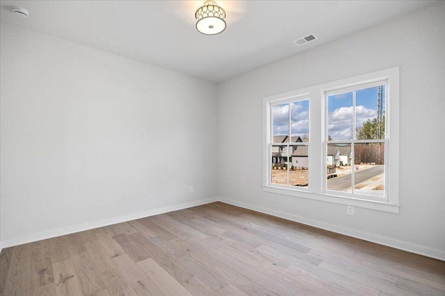 2035 Village Walk, Milton, GA 30004 - empty room with light wood-style flooring, baseboards, and a smoke detector