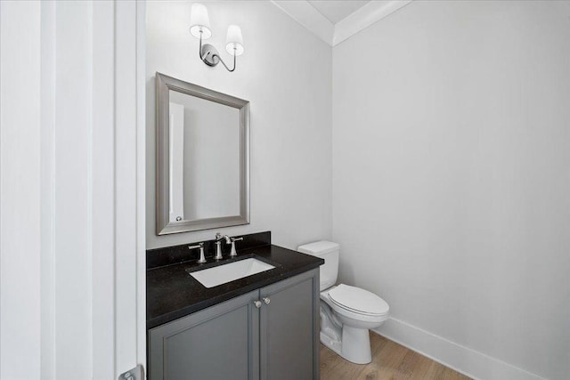 2035 Village Walk, Milton, GA 30004 - half bath featuring toilet, vanity, baseboards, and wood finished floors