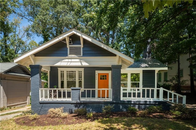943 Rose Cir SW, Atlanta, GA 30310 - view of front of home featuring a porch and a detached garage