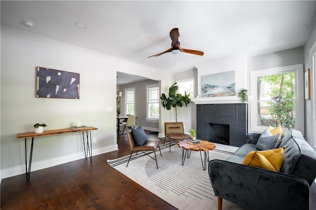 943 Rose Cir SW, Atlanta, GA 30310 - living room featuring a fireplace, wood finished floors, and ceiling fan