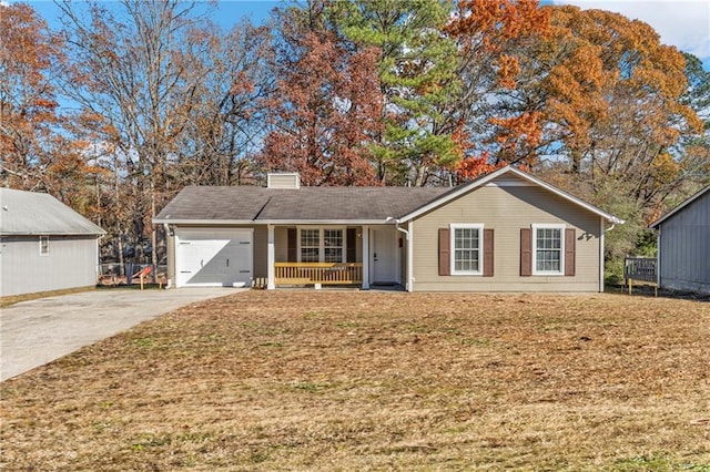 single story home with a garage, covered porch, and a front yard