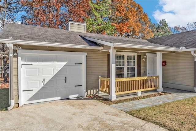 view of front of home featuring a porch and a garage