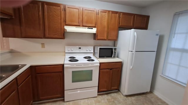 340 Teal Ct, Roswell, GA 30076 - kitchen featuring white appliances, under cabinet range hood, and brown cabinets