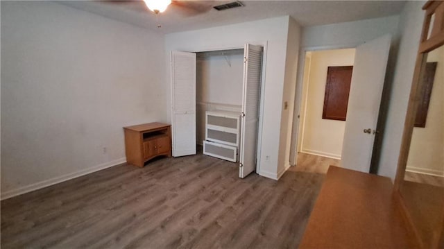 340 Teal Ct, Roswell, GA 30076 - unfurnished bedroom with wood finished floors, a closet, baseboards, and a ceiling fan