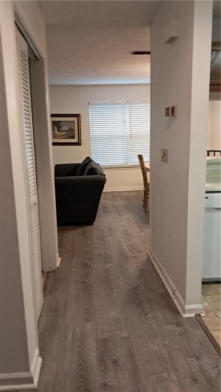 340 Teal Ct, Roswell, GA 30076 - hallway featuring baseboards and wood finished floors