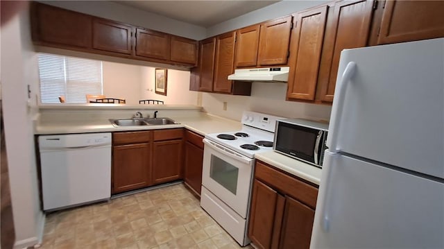 340 Teal Ct, Roswell, GA 30076 - kitchen featuring white appliances, under cabinet range hood, a sink, light countertops, and brown cabinets