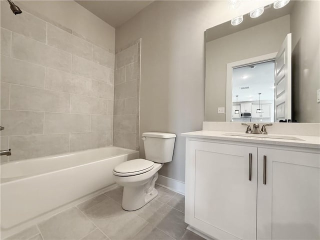 bathroom with toilet, vanity, shower / tub combination, tile patterned flooring, and baseboards