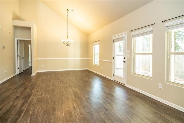 610 Sunflower Dr, Canton, GA 30114 - spare room with a chandelier, dark wood-style flooring, healthy amount of natural light, baseboards, and high vaulted ceiling