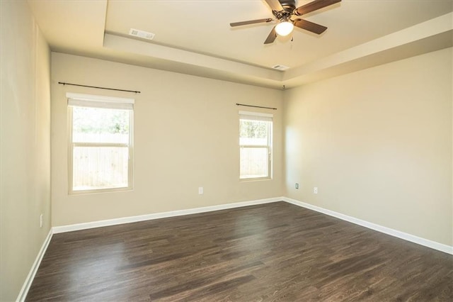 610 Sunflower Dr, Canton, GA 30114 - spare room with a raised ceiling, dark wood-style flooring, baseboards, and a ceiling fan