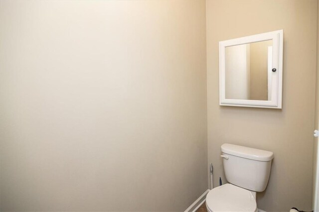 610 Sunflower Dr, Canton, GA 30114 - bathroom featuring toilet and baseboards