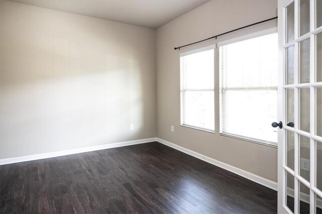 610 Sunflower Dr, Canton, GA 30114 - empty room featuring baseboards, plenty of natural light, and dark wood-style flooring