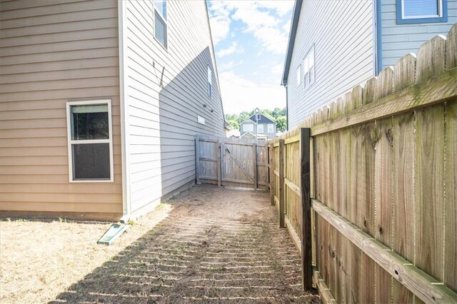 610 Sunflower Dr, Canton, GA 30114 - view of side of home featuring a gate
