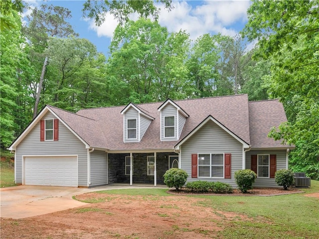 cape cod home with central AC, a front yard, roof with shingles, concrete driveway, and a porch