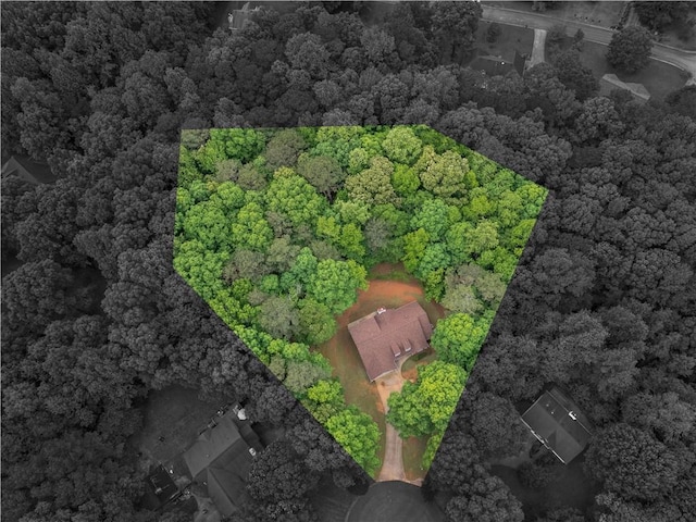 birds eye view of property with a forest view