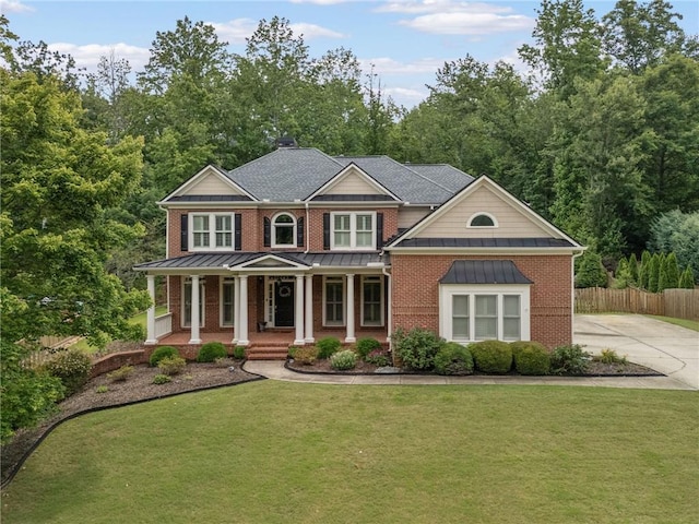 412 Mill Stream Way, Woodstock, GA 30188 - view of front facade featuring covered porch, a standing seam roof, brick siding, and metal roof