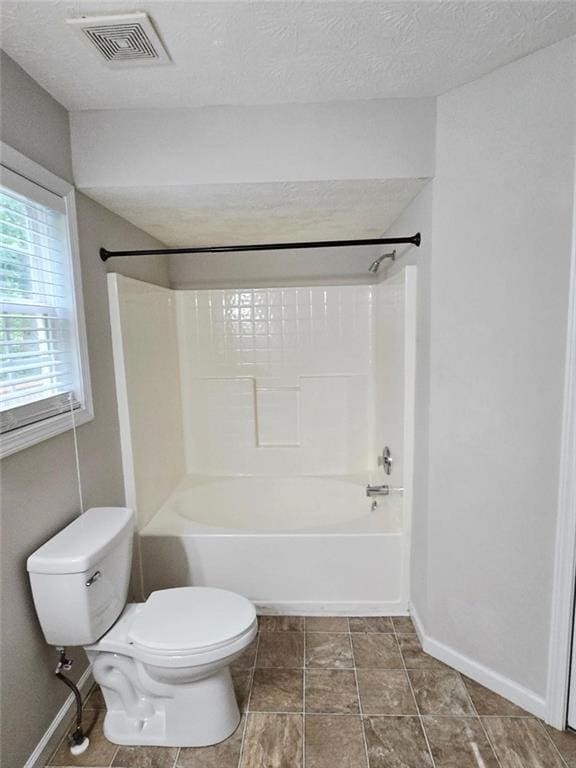 204 Twin Pines Ct, Dallas, GA 30132 - full bathroom featuring toilet, shower / tub combination, baseboards, and a textured ceiling
