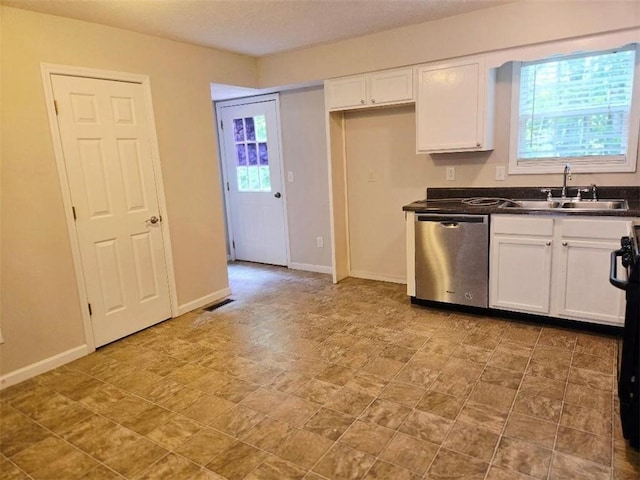 204 Twin Pines Ct, Dallas, GA 30132 - kitchen with stainless steel dishwasher, a sink, dark countertops, and white cabinets