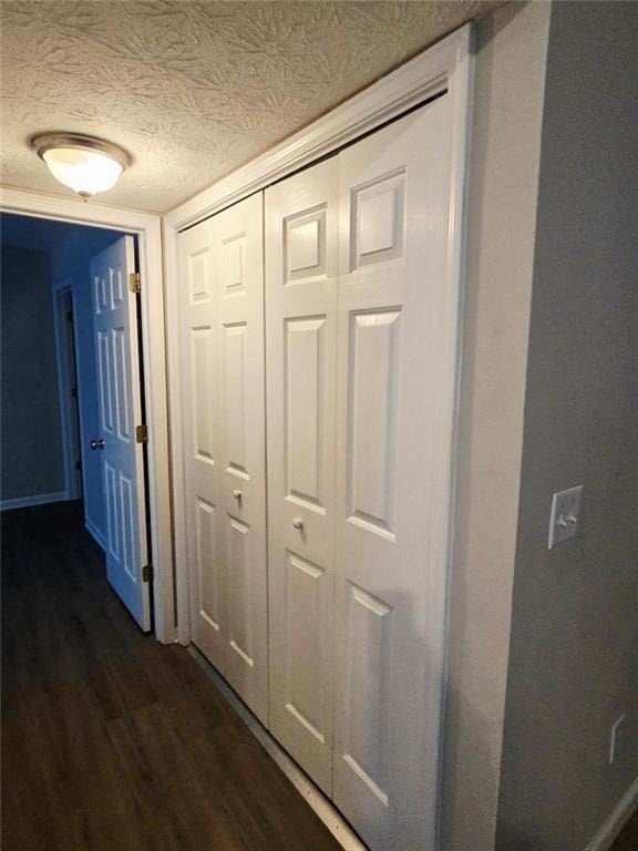 204 Twin Pines Ct, Dallas, GA 30132 - hall with dark wood finished floors, a textured ceiling, and baseboards