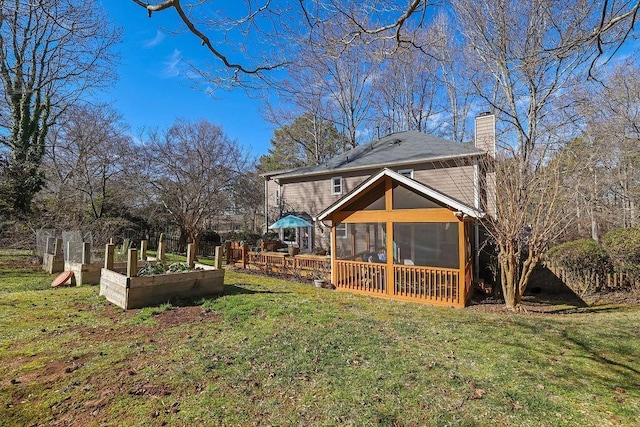 view of yard featuring a sunroom