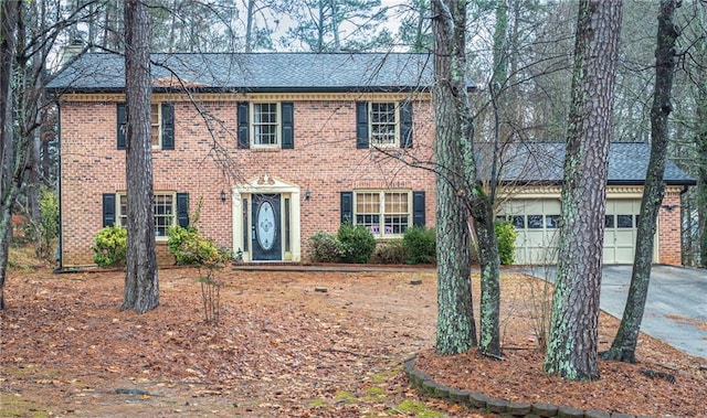 colonial home with a garage