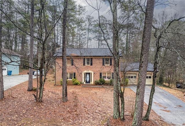 colonial-style house featuring a garage