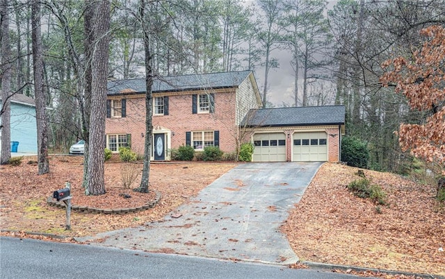 colonial-style house featuring a garage