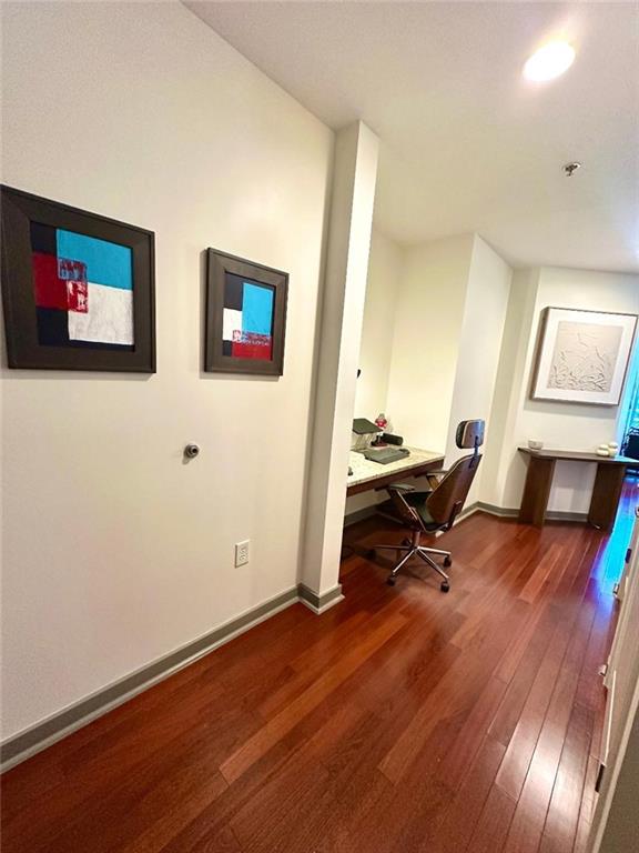 855 Peachtree St NE Unit 1406, Atlanta, GA 30308 - office featuring wood finished floors, baseboards, and built in study area