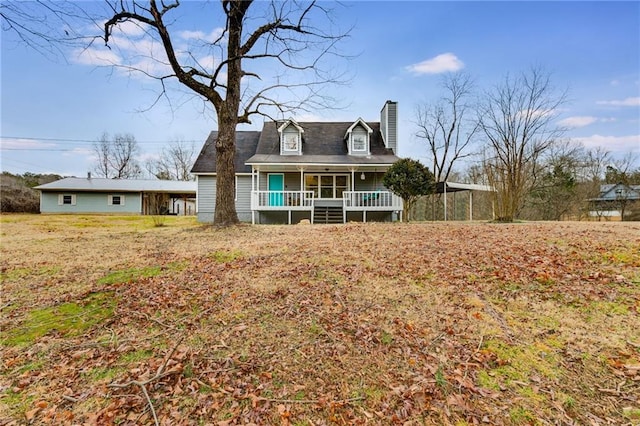 view of front of home featuring a porch and a carport