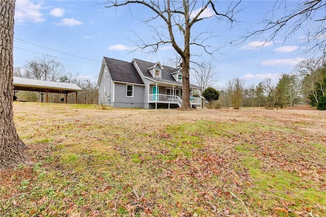 exterior space featuring a porch and a yard