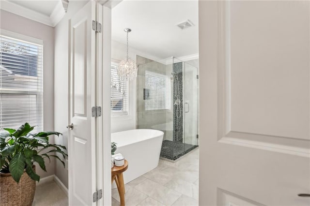 bathroom with a freestanding bath, visible vents, a shower stall, and an inviting chandelier