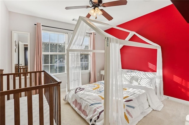 bedroom featuring carpet, baseboards, and a ceiling fan