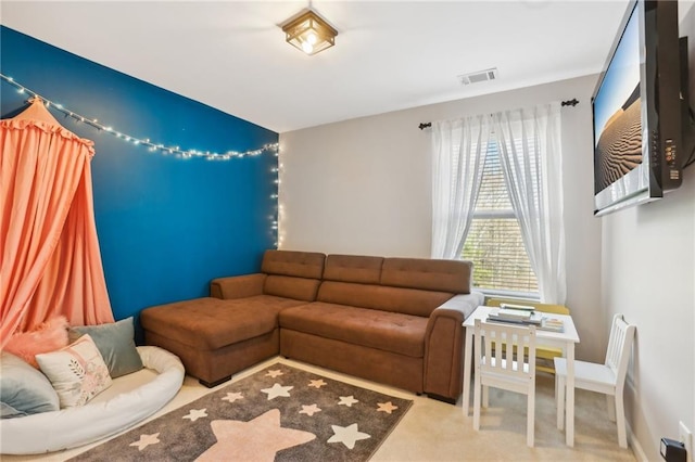 carpeted living area with visible vents