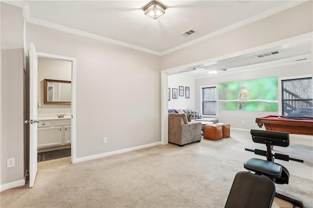 interior space with visible vents, baseboards, light carpet, ornamental molding, and pool table