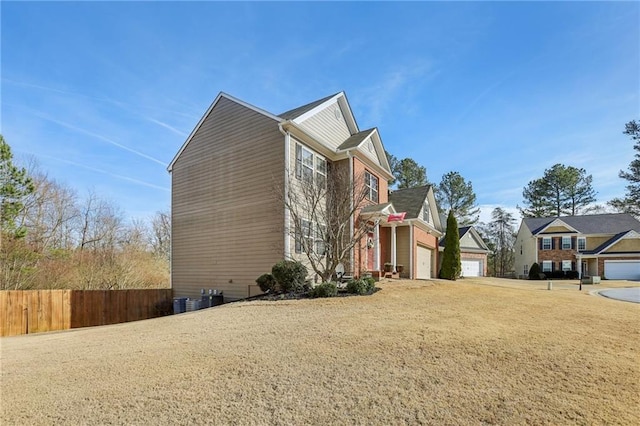 view of side of home with fence