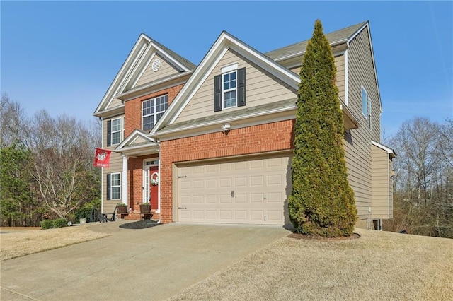 view of front of home featuring concrete driveway and brick siding
