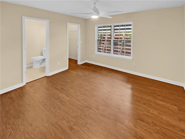 empty room featuring hardwood / wood-style floors and ceiling fan