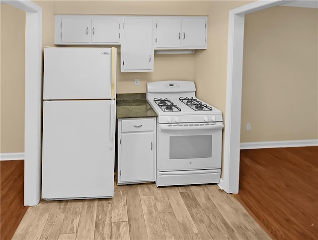 kitchen with white appliances, light hardwood / wood-style flooring, and white cabinets