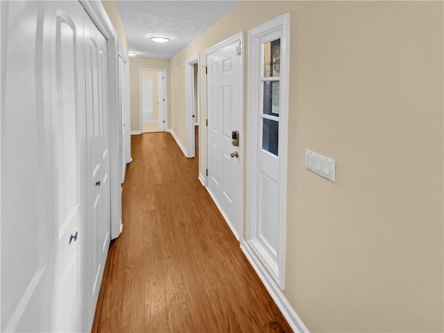 hallway featuring hardwood / wood-style floors