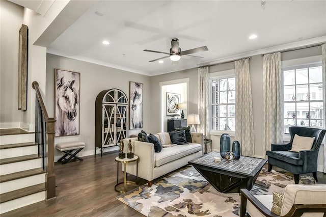 living area featuring ornamental molding, ceiling fan, stairway, recessed lighting, and dark wood-type flooring