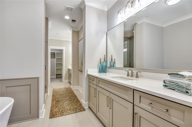 bathroom with crown molding, a stall shower, and visible vents