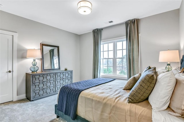 bedroom featuring visible vents and carpet