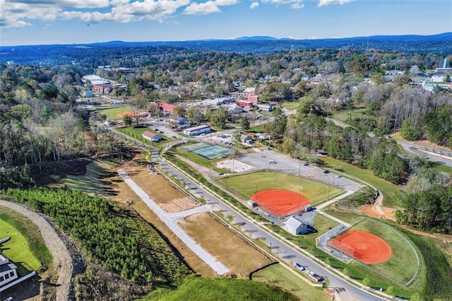 birds eye view of property featuring a forest view