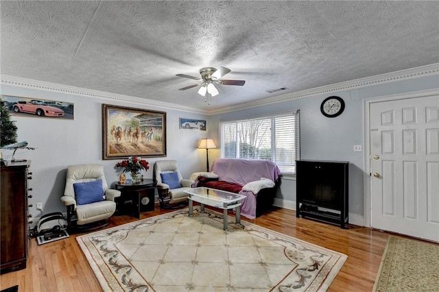 6118 Queen Anne Ct, Norcross, GA 30093 - living room featuring wood finished floors, ornamental molding, a ceiling fan, and a textured ceiling