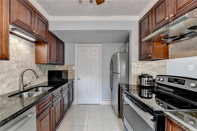 6118 Queen Anne Ct, Norcross, GA 30093 - kitchen with appliances with stainless steel finishes, under cabinet range hood, a sink, tasteful backsplash, and dark stone countertops
