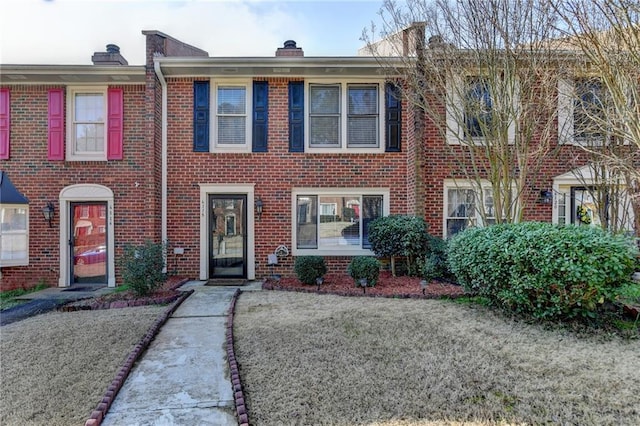 6118 Queen Anne Ct, Norcross, GA 30093 - view of property with brick siding and a chimney