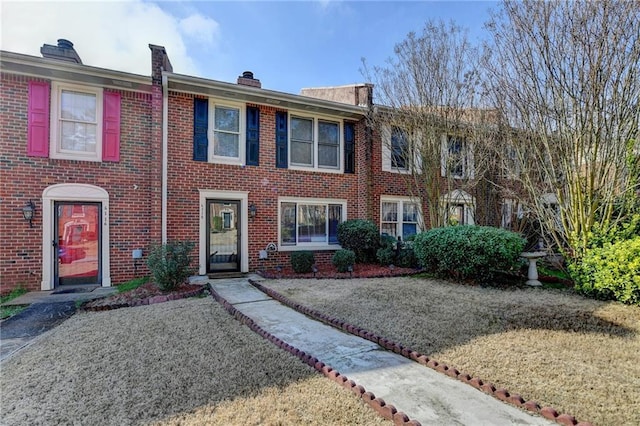 6118 Queen Anne Ct, Norcross, GA 30093 - view of property with brick siding and a chimney